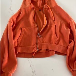 Orange zip up